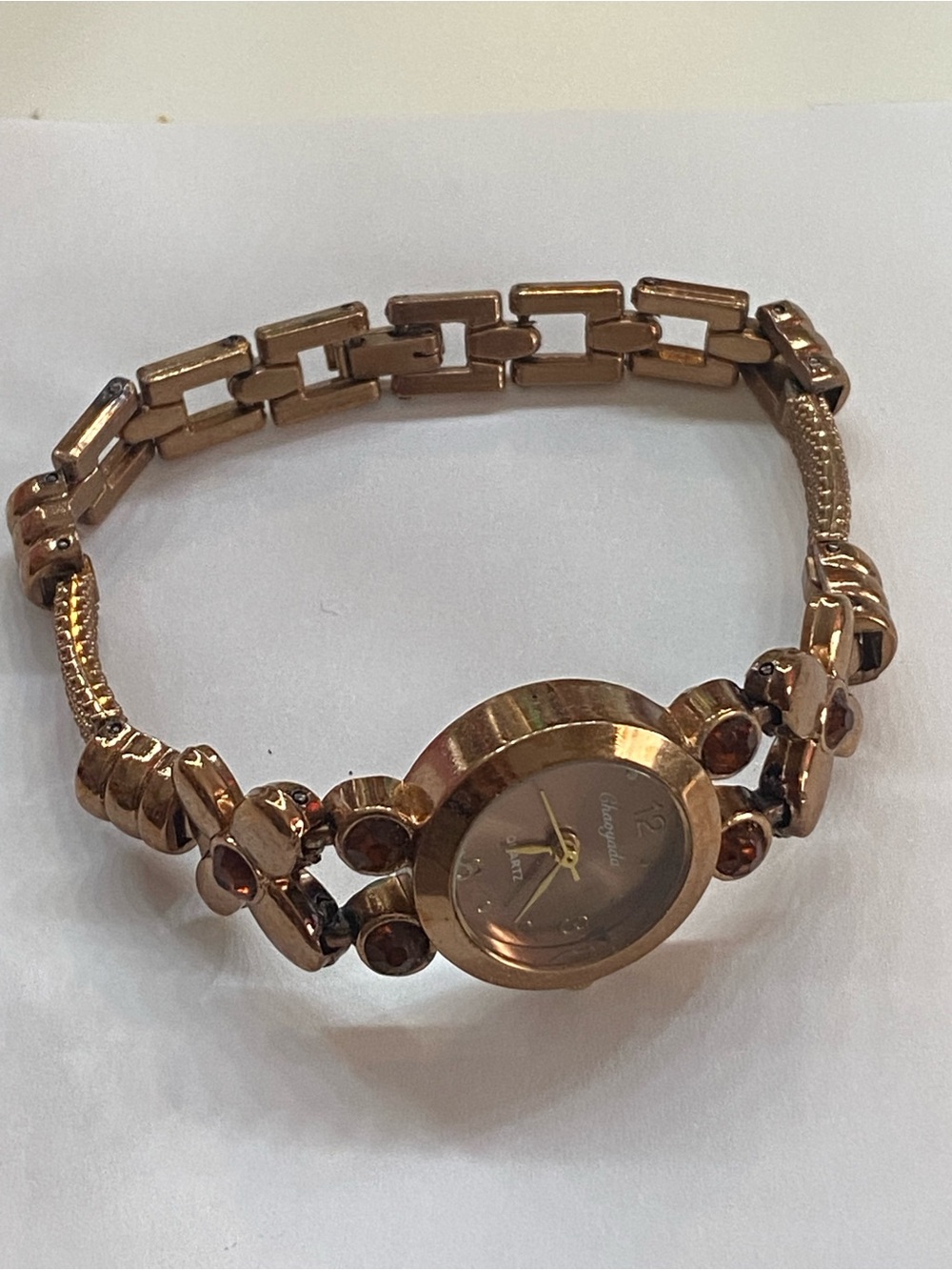 Gold tone Women's Bracelet Watch with red gems